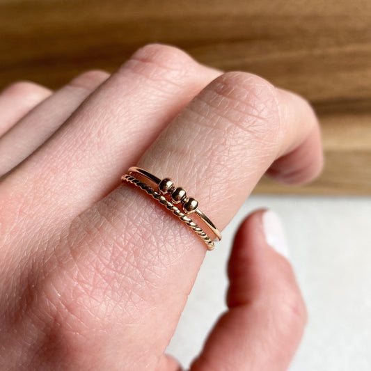 Gold Fidget Anxiety Bead ring stacked with rope stacking ring
